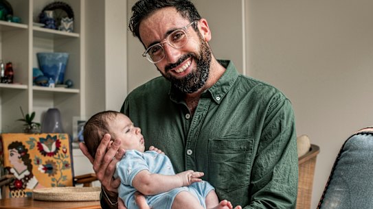 Dr. Zach Sadler with his son Artemis.