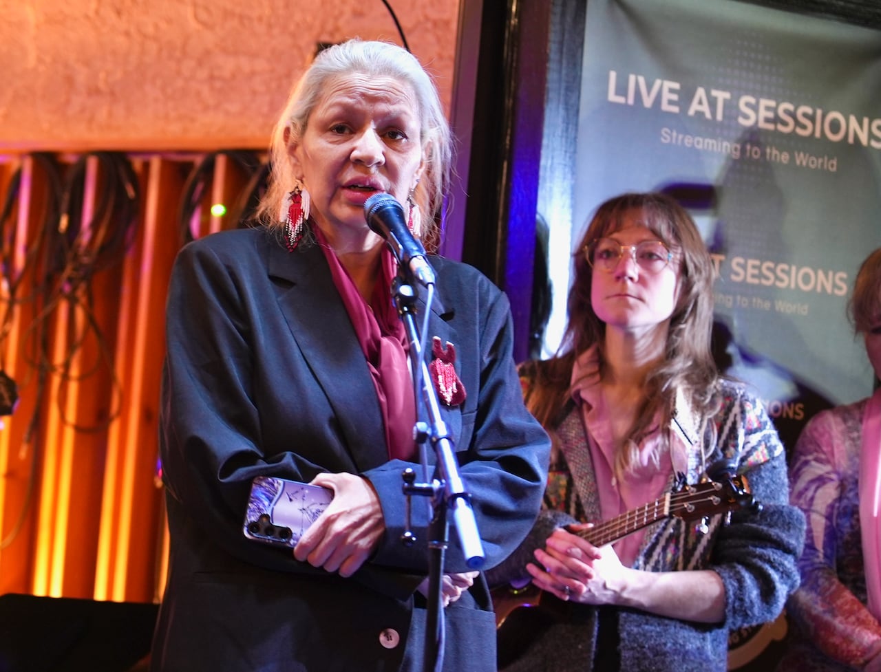 A woman is speaking on stage.