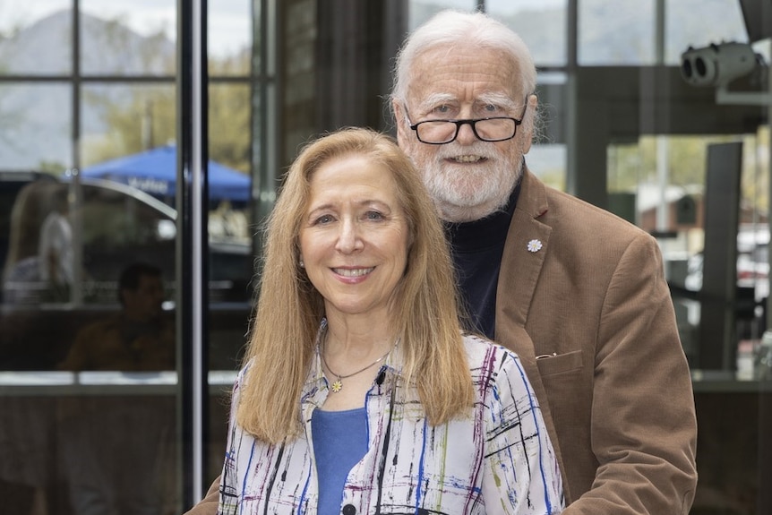 A man and a woman are standing together. 