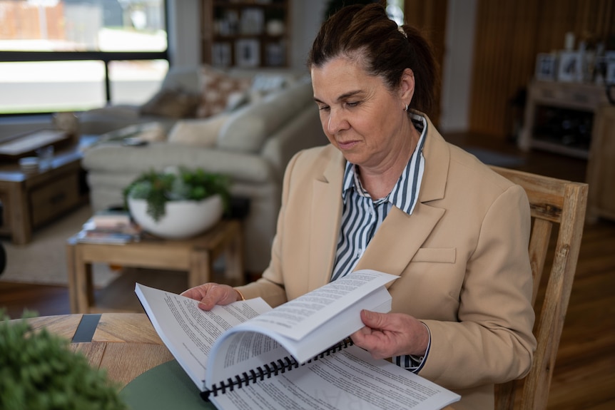 A woman is looking for the first edition of a book she wrote. 