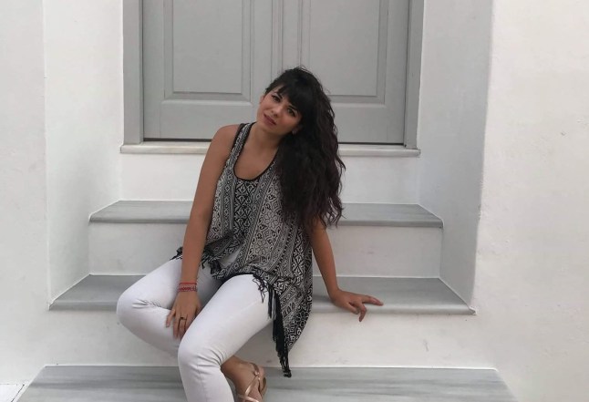 Dimitra Stiko poses on the stairs